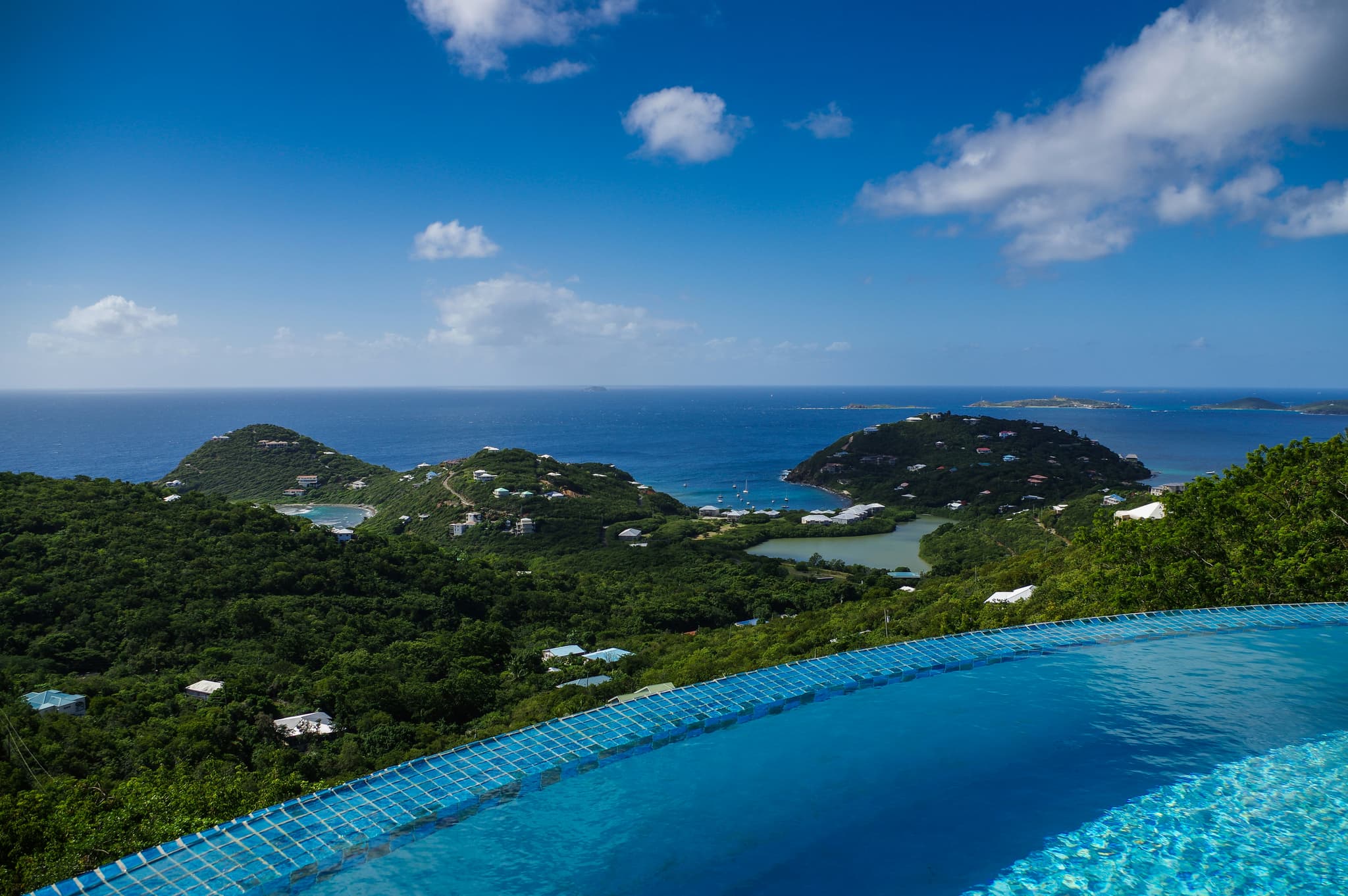 Luxury infinity pool overlooking tropical Thai landscape