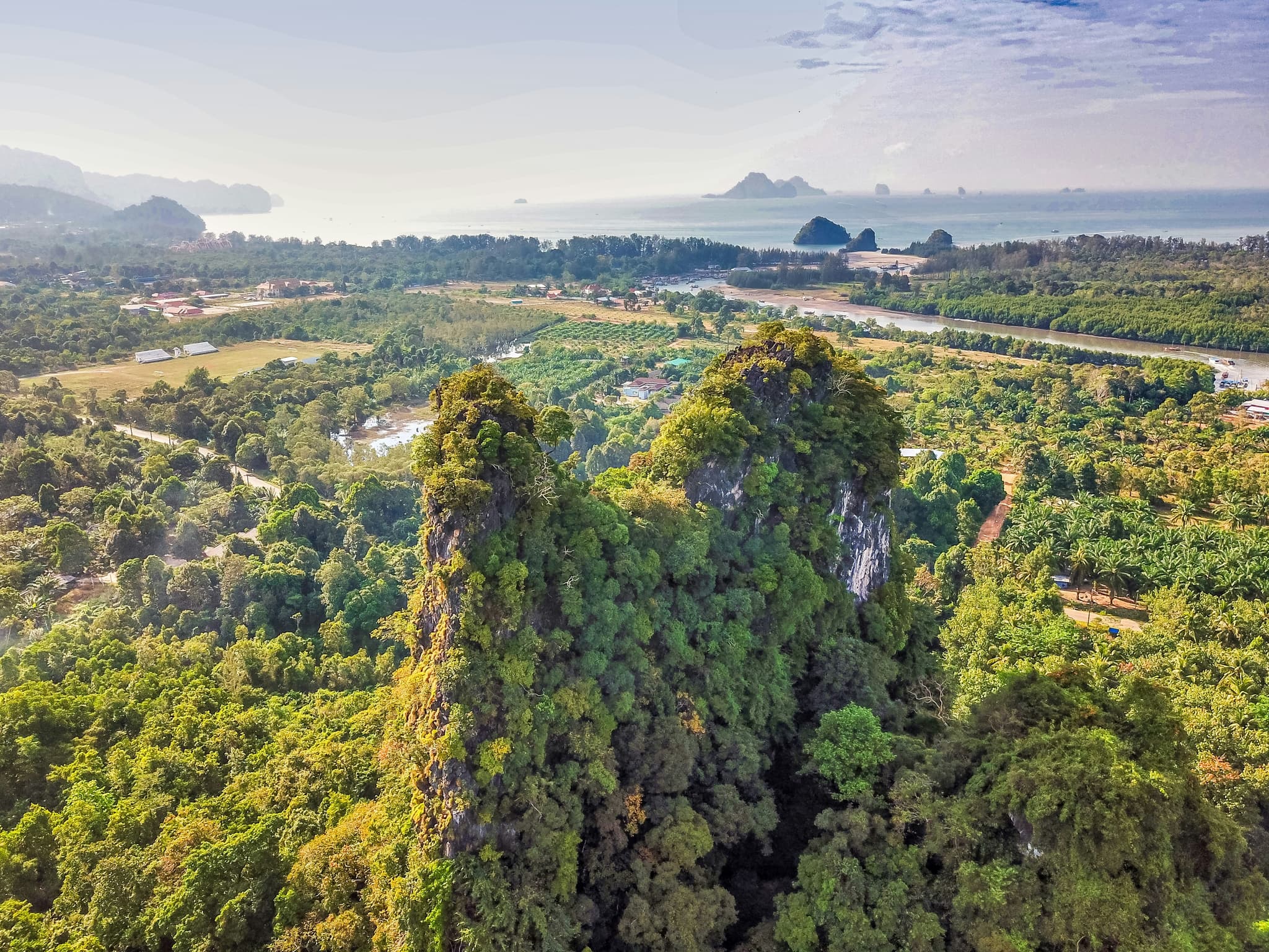 Khao Sok National Park ancient rainforest with dramatic limestone karsts and emerald lake Thailand
