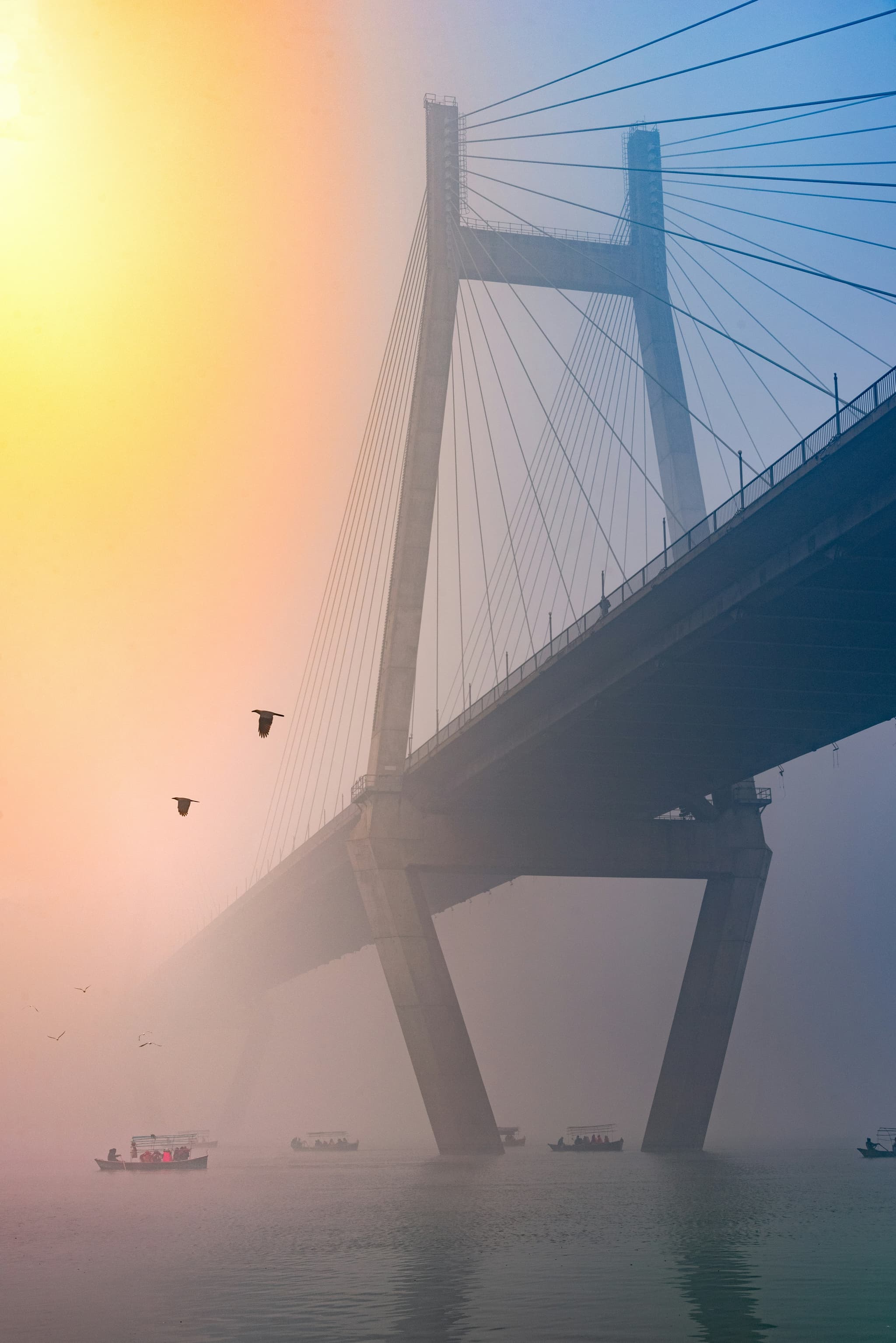 Bridge over the River Kwai in Kanchanaburi Thailand with misty morning atmosphere