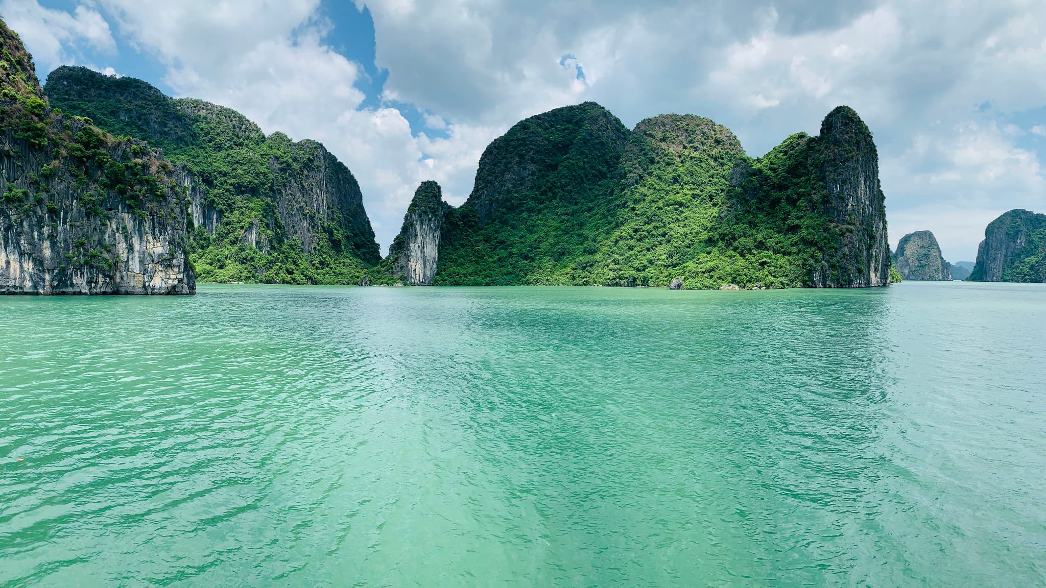 Ha Long Bay Vietnam with limestone karst islands rising from emerald green waters