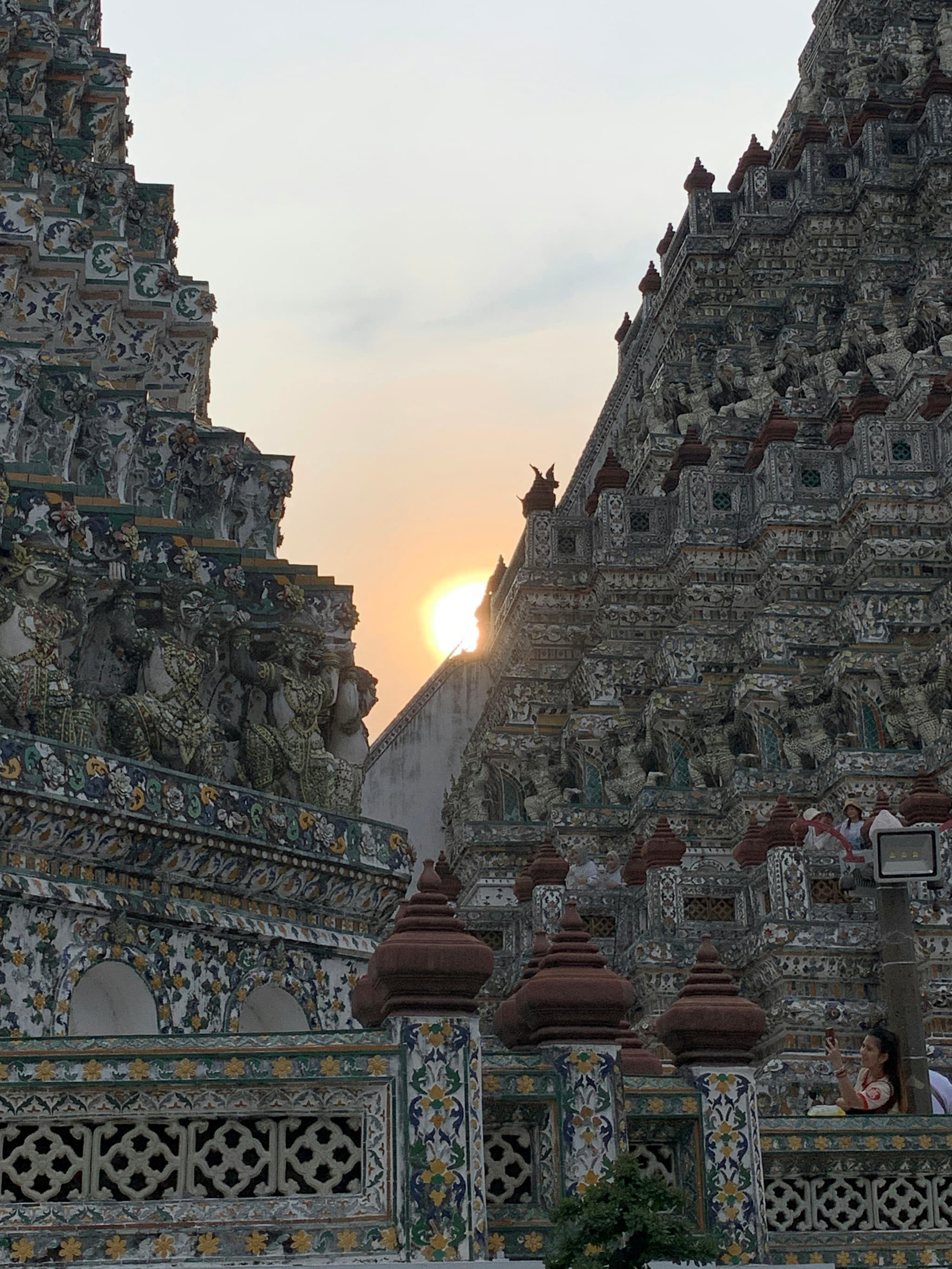 Golden Thai temple with intricate architecture at sunset