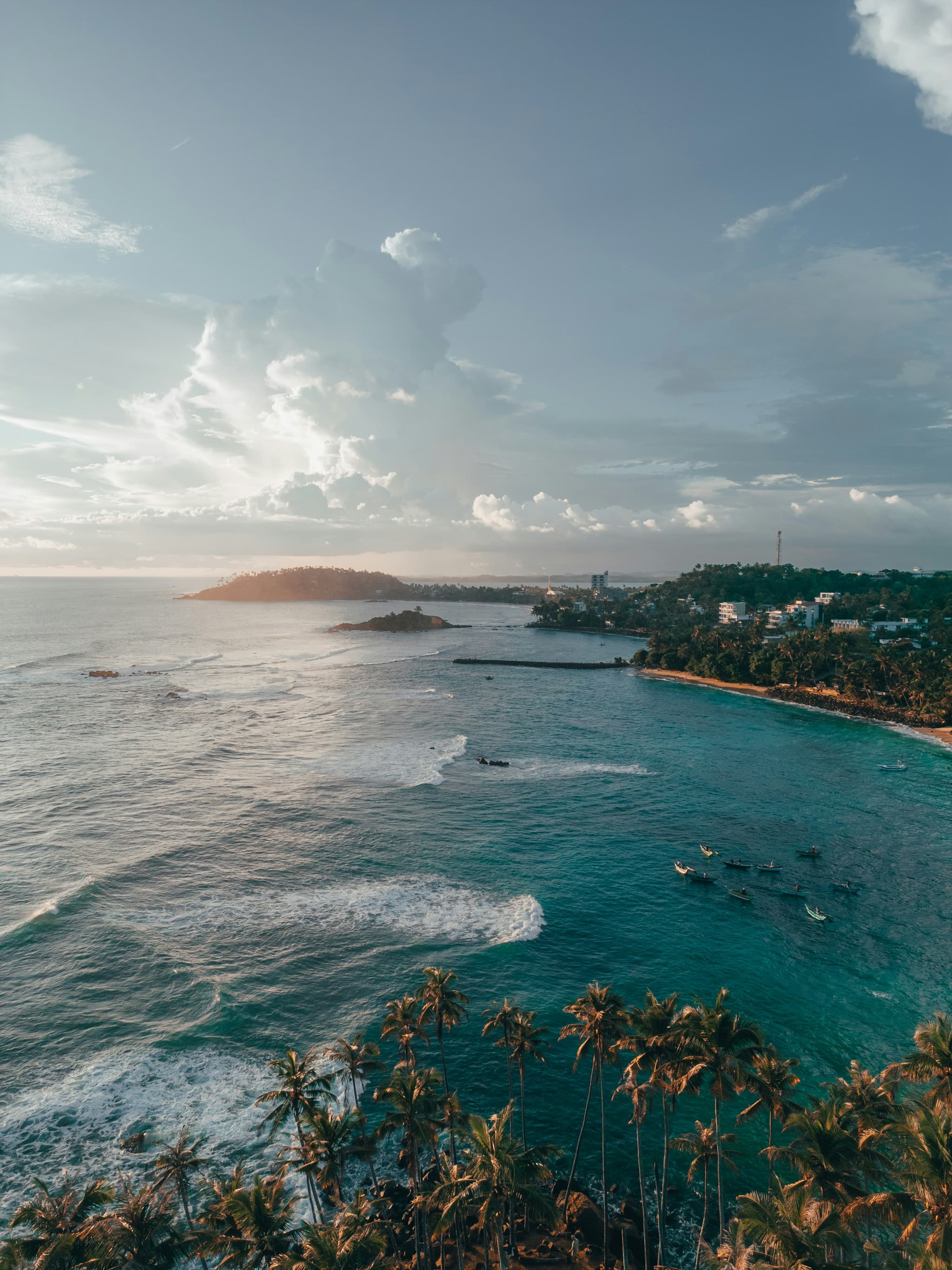 Koh Phangan tropical beach with turquoise water and palm trees at sunset